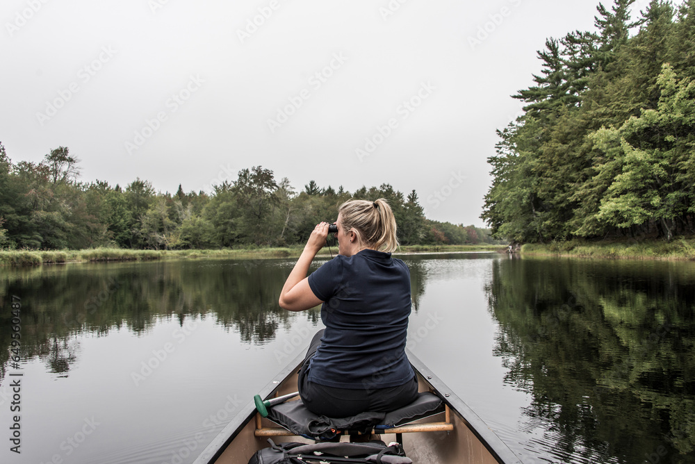 blonde Girl Canoe ride exploring nature on morning mist Kejimkujik National Park Wilderness Nova Scotia Canada blonde Girl Canoe ride exploring nature on morning mist Kejimkujik National Park Wilderness Nova Scotia Canada