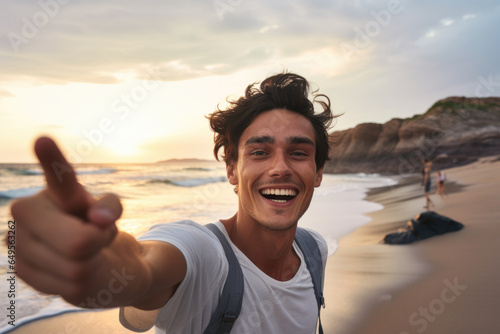Man on beach showing thumbs up gesture. This picture can be used to represent positivity and approval in various contexts.