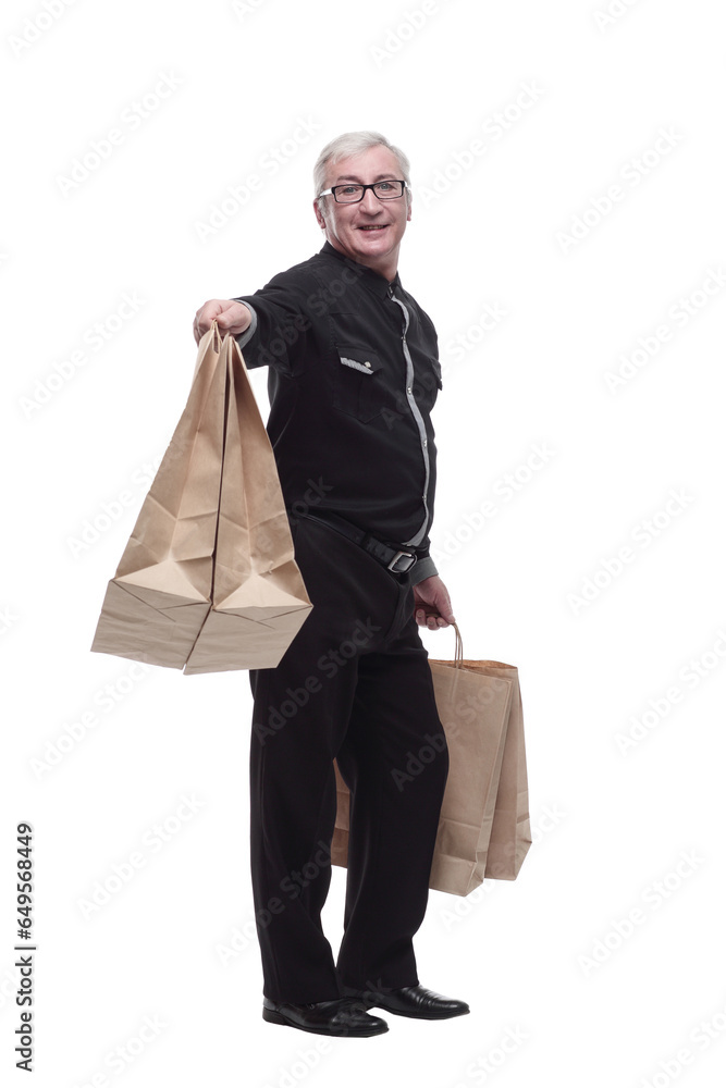 in full growth. happy casual man with shopping bags. in full growth. happy casual man with shopping bags.