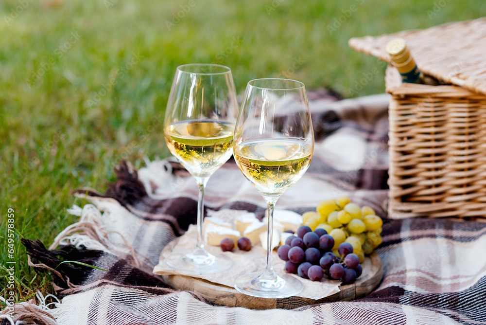 picnic outdoor with tasty food and wine