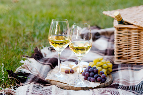 picnic outdoor with tasty food and wine