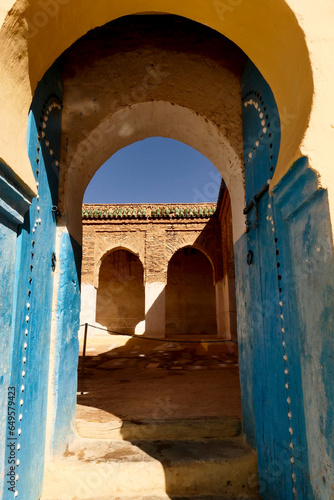 La moschea di Zaouia Timguidcht con il suo minareto dal tetto di tegole verdi. Regione di Tafraout, Souss Massa. Marocco photo