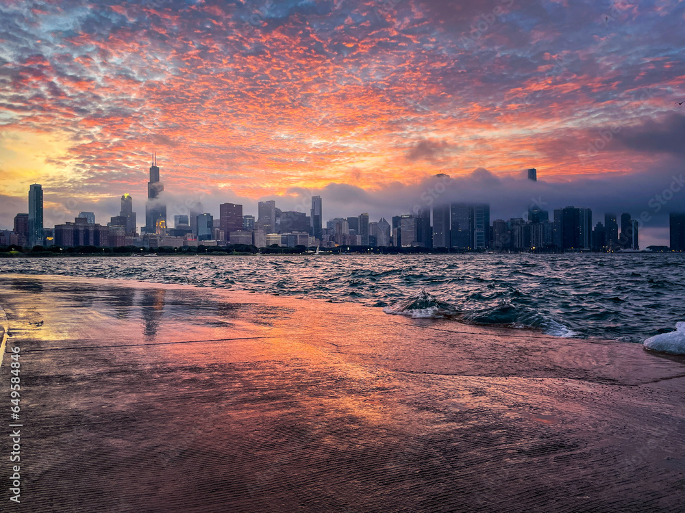 Chicago skyline with dramatic clouds at sunset.