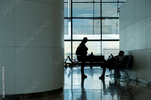 Passenger silhouettes in terminal T4 of Madrid airport. Adolfo Suarez-Barajas. Arial transport concept photo