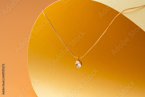 Принти на полотні Big diamond solitaire necklace with chain on yellow background