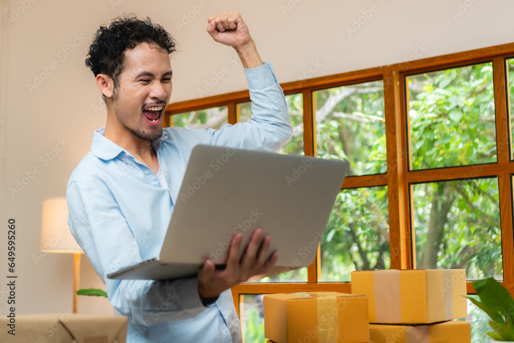 Happy business owner celebrate with the first order sell in cozy minimal living room,Freelance startup success concept Happy business owner celebrate with the first order sell in cozy minimal living room,Freelance startup success concept