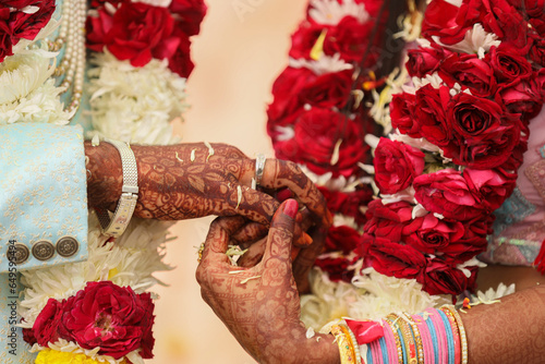Fotografie Indian groom and bride hand in hand showing ring