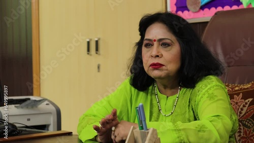 Experienced school principal having an important discussion in office. Conference room meeting. Woman empowerment. Kids admission open for school. 