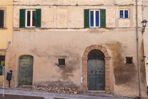 Calvi dell'Umbria Building Facade with Windows and Old Aged Wooden Doors, Italy © Monica
