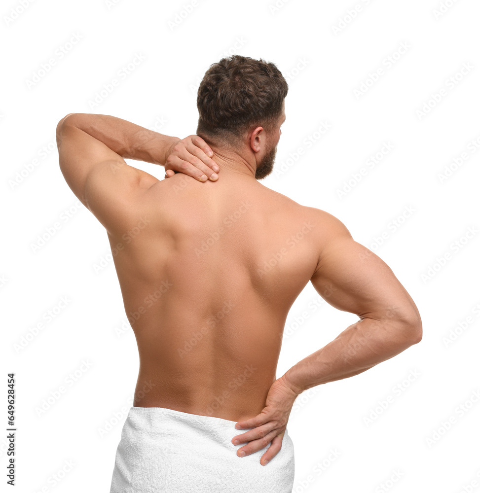Man suffering from back pain on white background, back view Man suffering from back pain on white background, back view