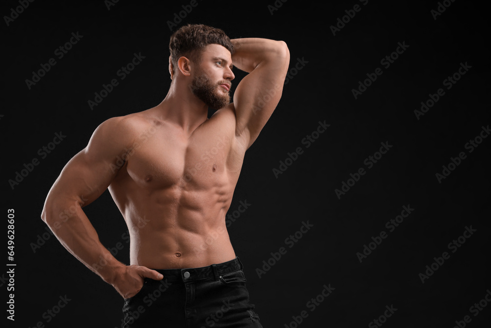 Handsome muscular man on black background, space for text. Sexy body Handsome muscular man on black background, space for text. Sexy body