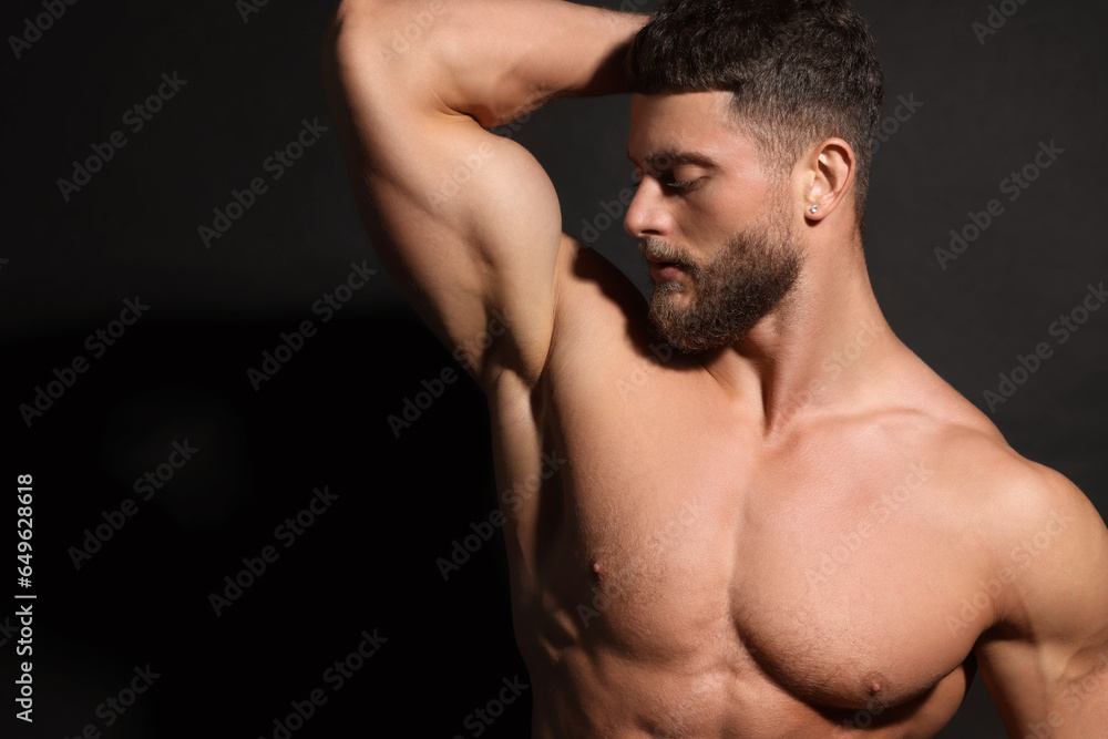 Handsome muscular man on black background. Sexy body Handsome muscular man on black background. Sexy body