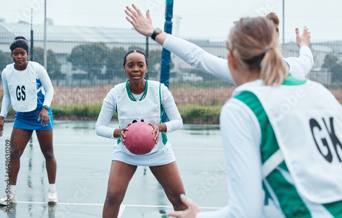 Netball, sports and team with ball and women in community competition, practice and play outdoor game. Fitness, collaboration or group workout, player tournament or athlete training on court