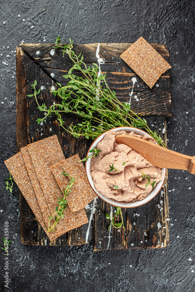 Fresh homemade chicken liver pate on a wooden board. vertical image. top view. place for text - obrazy, fototapety, plakaty 