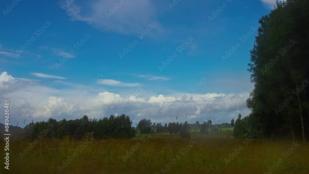Fast Moving Clouds Across the Countryside Fields of Latvia of a Motion Timelapse. Fast Moving Clouds Across the Countryside Fields of Latvia of a Motion Timelapse.