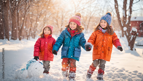 happy beautiful children playing with snow