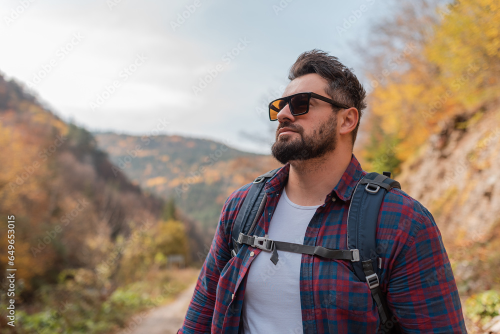 A handsome man hiker hiking in mountain forest adventure travel. A handsome man hiker hiking in mountain forest adventure travel.