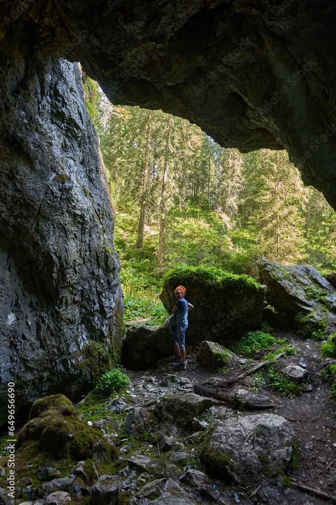 Woman exploring a cave