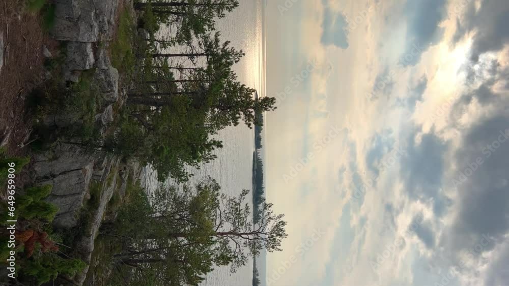 Russia, Karelia, Lake Ladoga, Koyonsaari. View of the coast of the island in a cold lake. Beautiful nature of the Republic of Karelia. Stunning panoramic view of the Ladoga Skerry Islands. 4K Russia, Karelia, Lake Ladoga, Koyonsaari. View of the coast of the island in a cold lake. Beautiful nature of the Republic of Karelia. Stunning panoramic view of the Ladoga Skerry Islands. 4K
