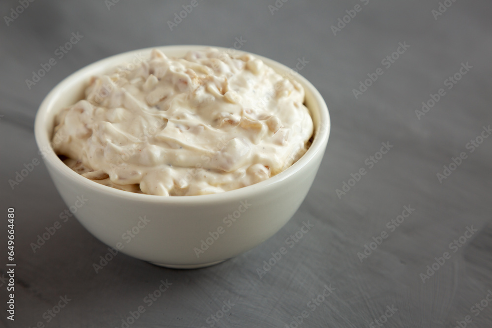 Homemade French Onion Dip in a Bowl on a gray background, side view. Copy space. Homemade French Onion Dip in a Bowl on a gray background, side view. Copy space.