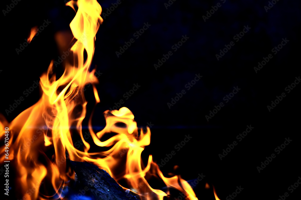Fototapeta premium Background of the flame in the oven. Tongues of fire in a fireplace. Fire texture.
