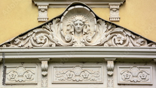 A fragment of the stucco decoration of an old building