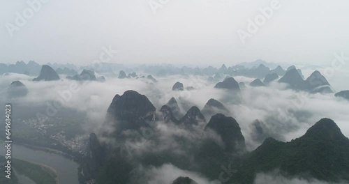 The natural scenery of karst mountain peaks in the morning fog in Xingping Town, Yangshuo County, Guilin, Guangxi, China