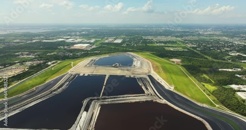 Aerial view of large open air phosphogypsum waste stack near Tampa, Florida. Potential danger of disposing byproduct of phosphate fertilizer production photo