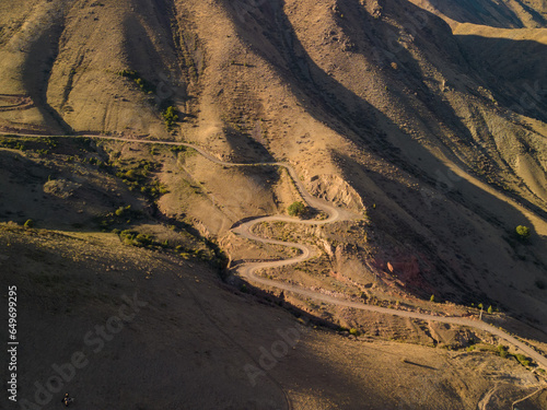 winding road in brown hills