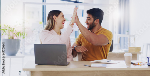 Creative business people, laptop and high five for winning, success or planning together in teamwork at office. Happy man and woman touching hands on touchscreen for team collaboration or achievement © Wesley JvR/peopleimages.com