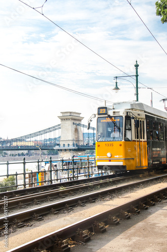 Budapest, Hungary, August 15, 2023. Yellow Tramway and City Chain Bridge in Budapest.