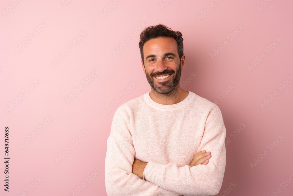 portrait of a confident Israeli man in his 30s wearing a chic cardigan against a pastel or soft colors background portrait of a confident Israeli man in his 30s wearing a chic cardigan against a pastel or soft colors background