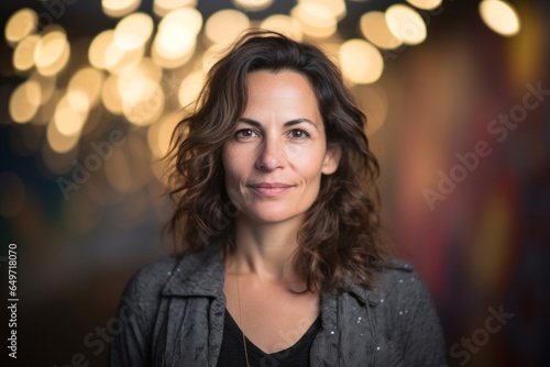 Wallpaper Mural portrait of a confident Israeli woman in her 40s wearing a chic cardigan against an abstract background Torontodigital.ca