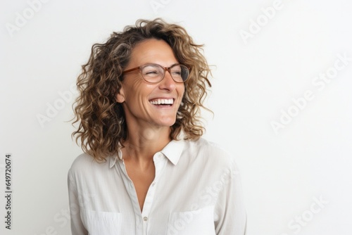 Portrait of a Israeli woman in her 40s wearing a chic cardigan against a white background photo