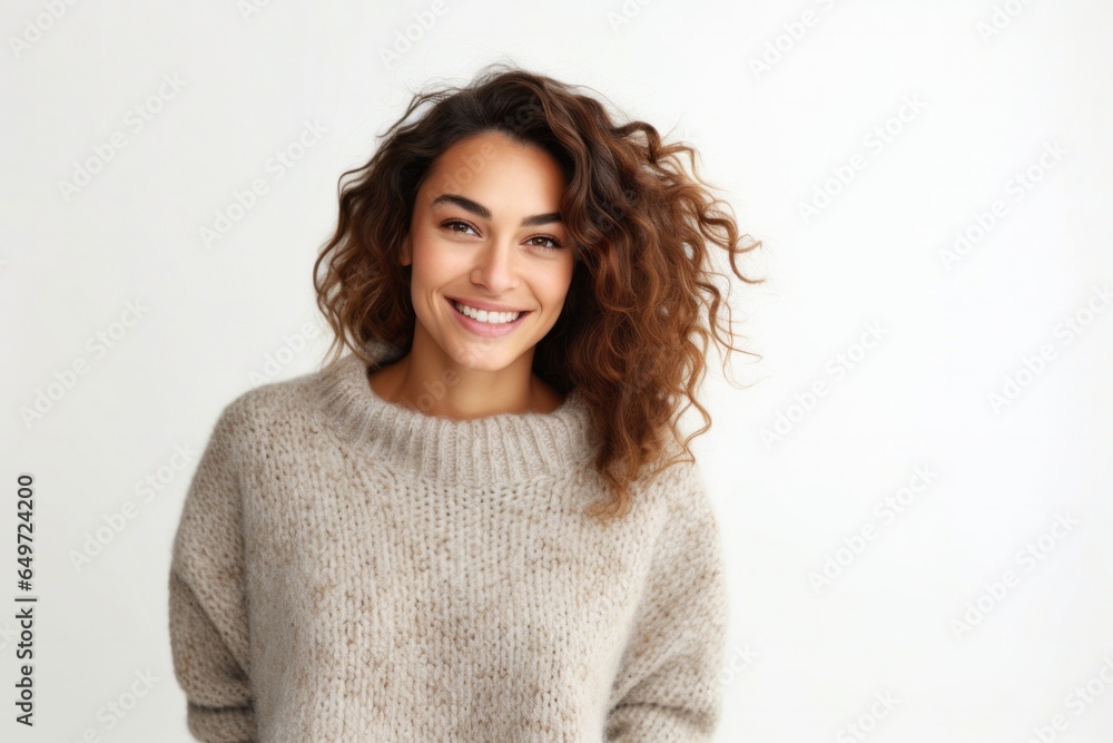 medium shot portrait of a happy Israeli woman in her 30s wearing a cozy sweater against a white background medium shot portrait of a happy Israeli woman in her 30s wearing a cozy sweater against a white background