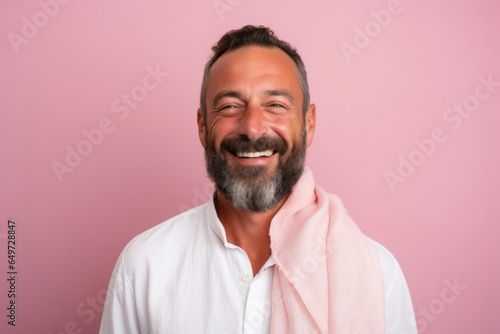 medium shot portrait of a Israeli man in his 40s wearing a foulard against a pastel or soft colors background