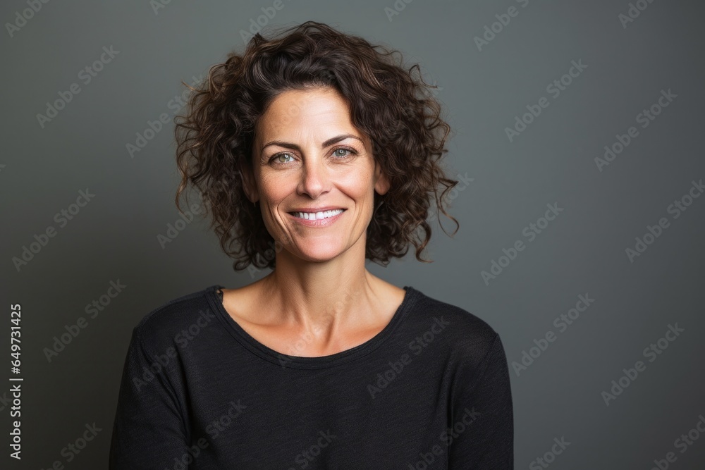 portrait of a Israeli woman in her 40s wearing a chic cardigan against a minimalist or empty room background portrait of a Israeli woman in her 40s wearing a chic cardigan against a minimalist or empty room background
