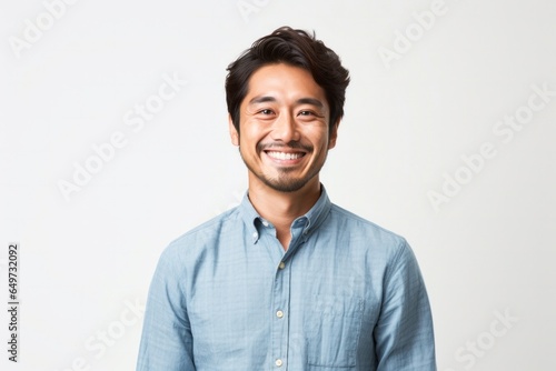 portrait of a Japanese man in his 30s wearing a foulard against a white background photo
