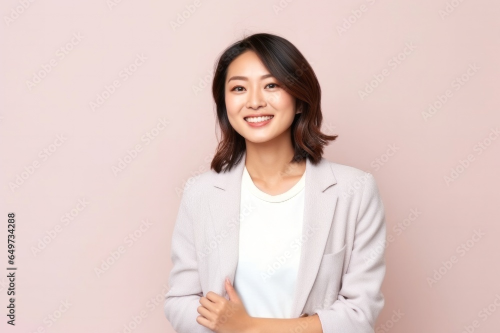 medium shot portrait of a confident Japanese woman in her 30s wearing a chic cardigan against a pastel or soft colors background medium shot portrait of a confident Japanese woman in her 30s wearing a chic cardigan against a pastel or soft colors background