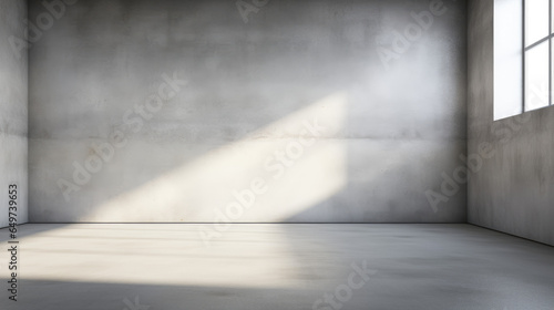 Empty room interior with concrete walls  grey floor with light and soft skylight from window. Background with copy-space. 