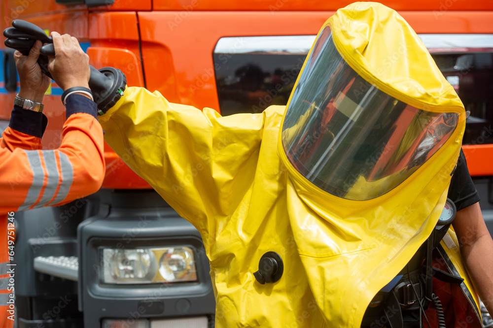 Rescue workers were wearing yellow hazmat suits with oxygen tanks ...