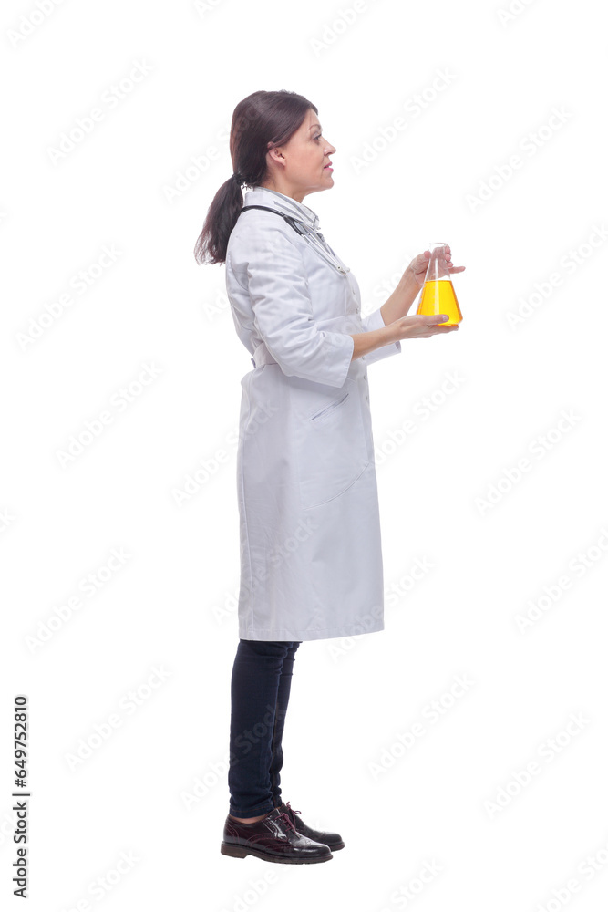 Scientist holding up beaker with of chemical yellow liquid Scientist holding up beaker with of chemical yellow liquid