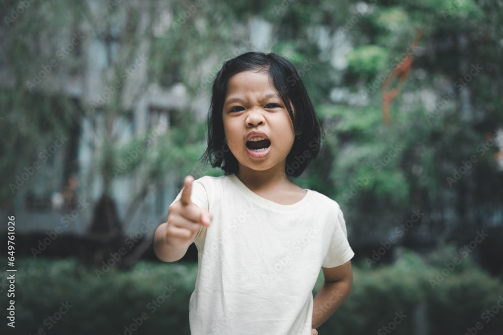 Portrait of angry emotional Asian girl screaming and frustrated shouting with anger, crazy and yelling on white background, Concept of attention deficit hyperactivity disorder ADHD Portrait of angry emotional Asian girl screaming and frustrated shouting with anger, crazy and yelling on white background, Concept of attention deficit hyperactivity disorder ADHD