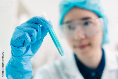Scientist analyzing and dro...