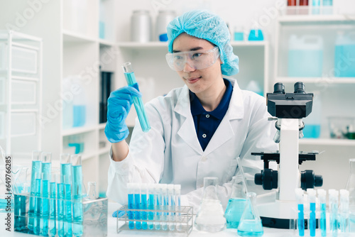 Scientist analyzing and dro...
