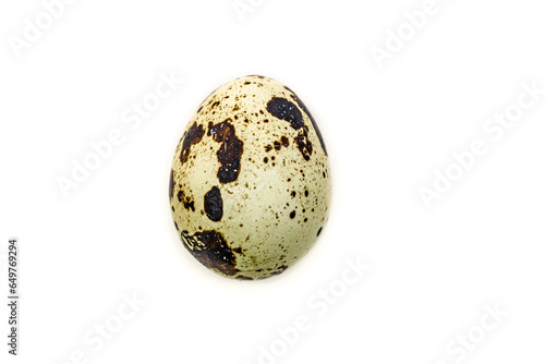 a small quail egg against white background