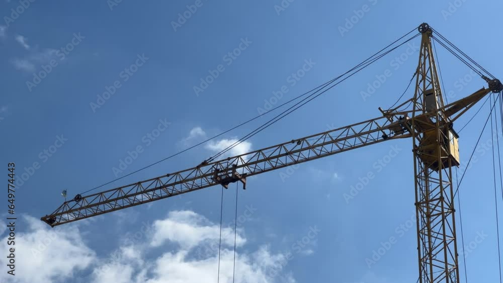 Construction Crane On The Background Of Clouds Construction Crane On The Background Of Clouds