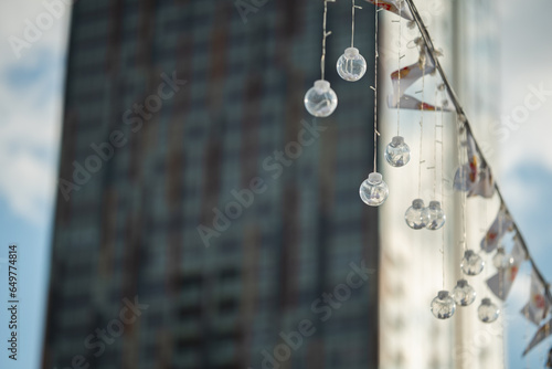 Decorative light bulbs and building on a background