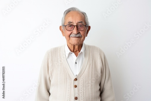 Portrait of a senior man with gray hair and glasses looking at camera on white background