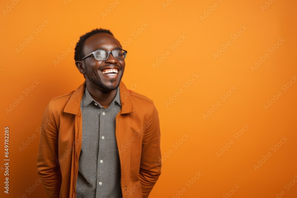 Delighted Senior Man with Beard and Glasses Smiling Against Yellow Background